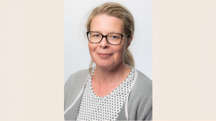 Smiling spectacled woman